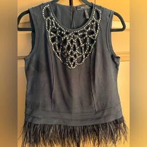 BCBG MaxAzria Elegant Black Sleeveless Top with Beaded Neckline & Feathered Hem
